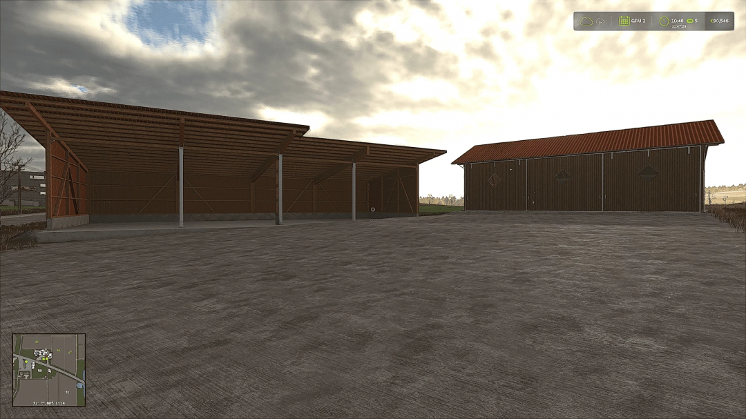 FS25 barnSet v1.0.0.0 mod featuring two barn structures with overcast sky in Farming Simulator 25.