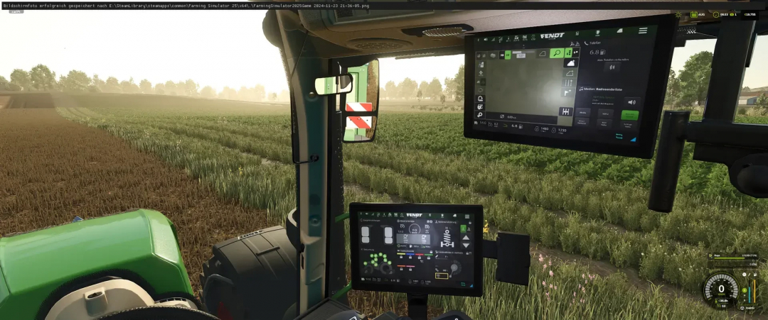 FS25 mod showing Fendt tractor cabin with advanced digital screens and a view of fields.