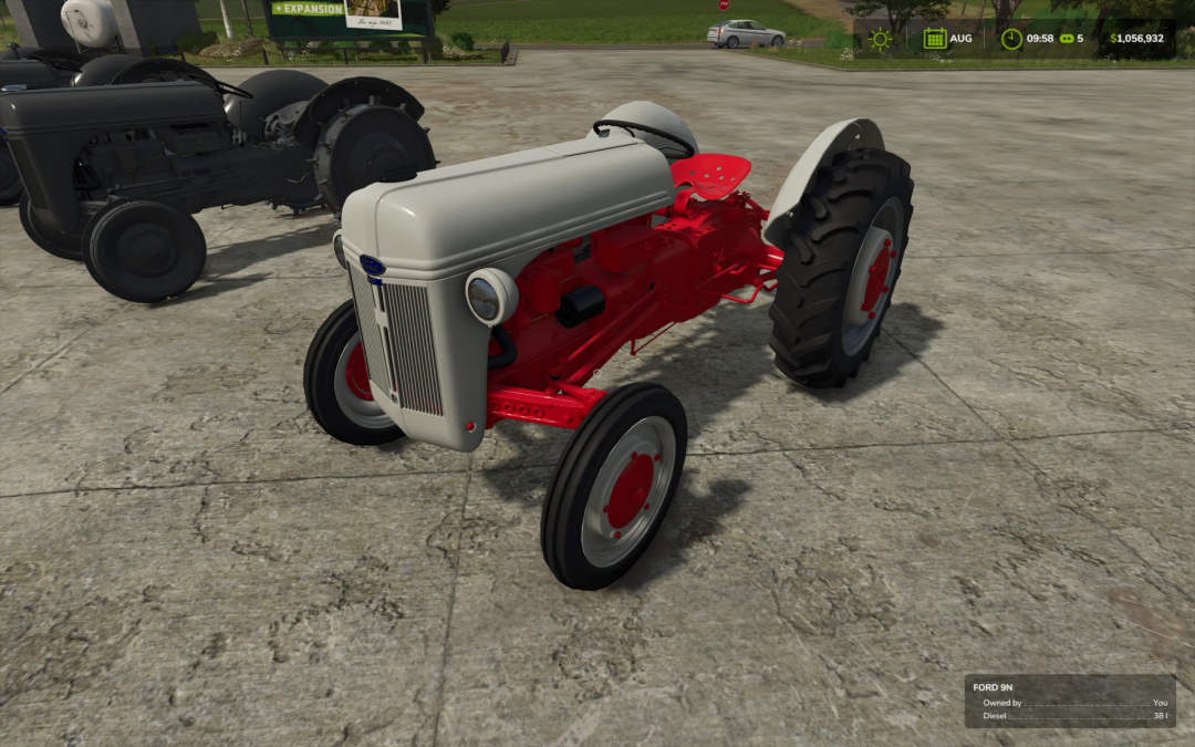 Ford N series tractor mod in Farming Simulator 25 with red and grey design on a farm lot.