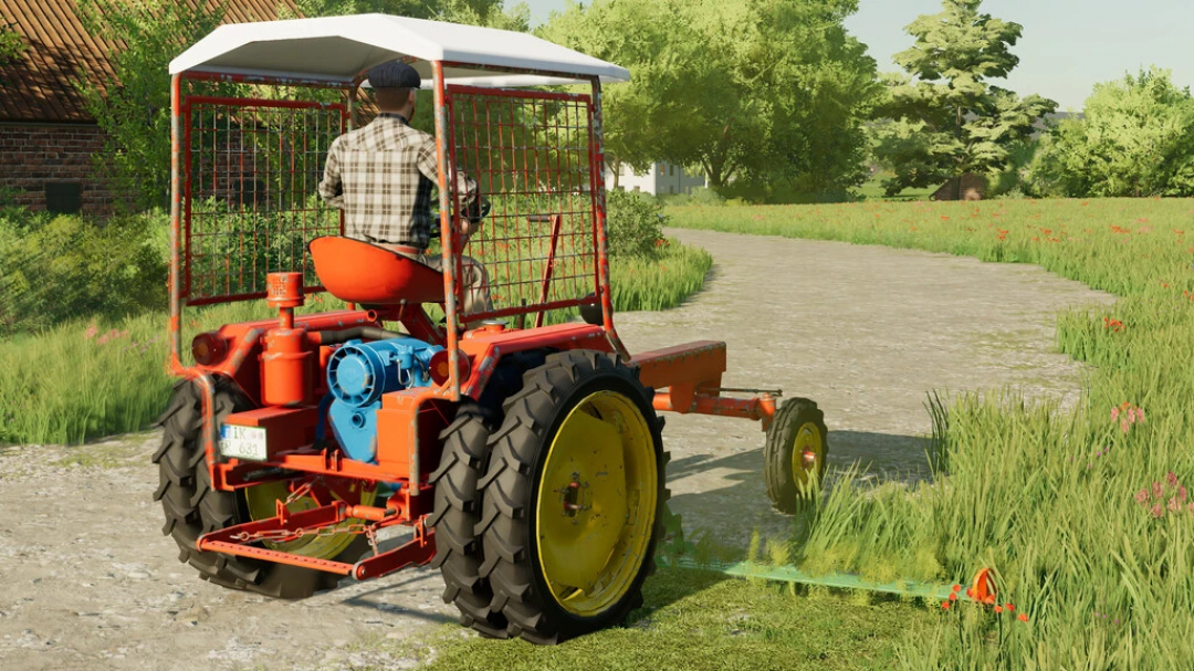 Mod FS22 Fortschritt RS09 tractor en un camino cubierto de hierba en Farming Simulator 22.