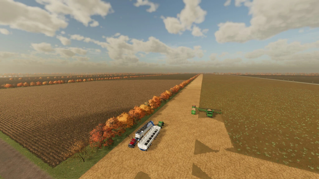 Aerial view of expansive fields on Gnadenthal Map in FS22, showcasing farming machinery and autumn foliage.