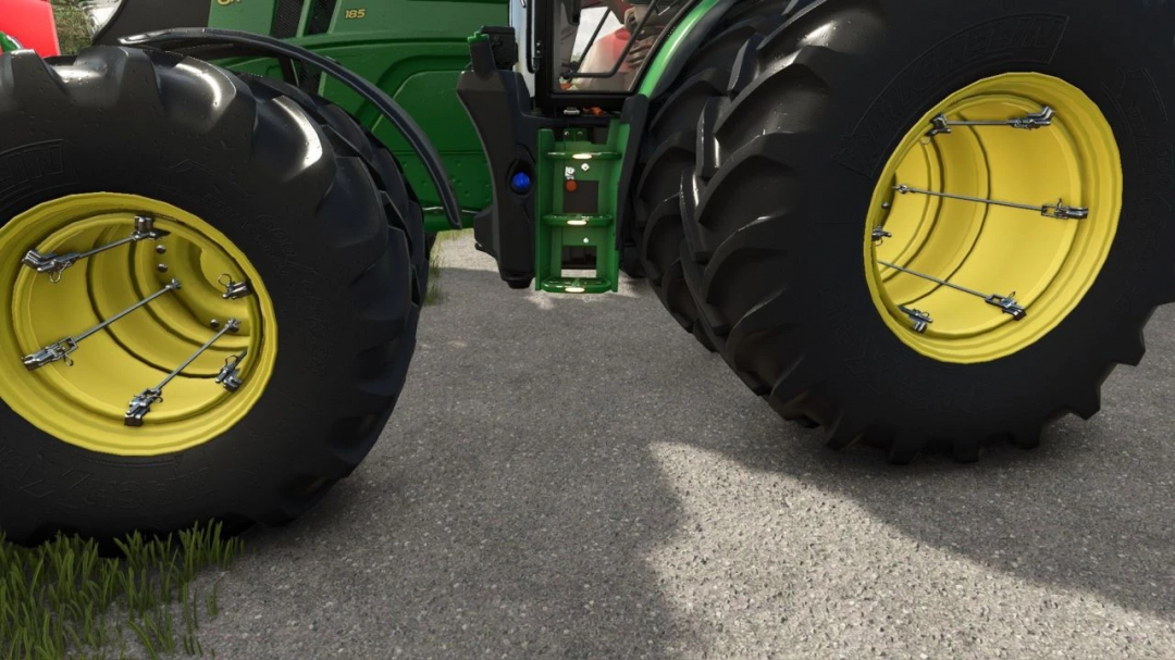 Close-up of John Deere 6R tractor wheels in FS25 mod, showcasing enhanced details in Farming Simulator 25.