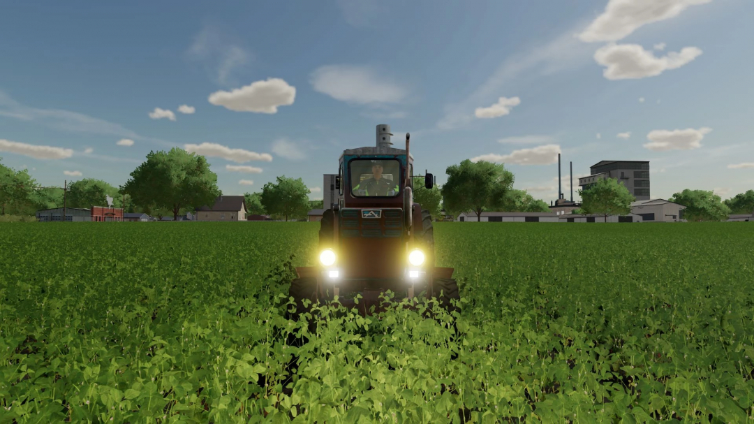 Old LTZ T-40 tractor mod in FS22 driving through a field, showcasing Farming Simulator 22 mods.