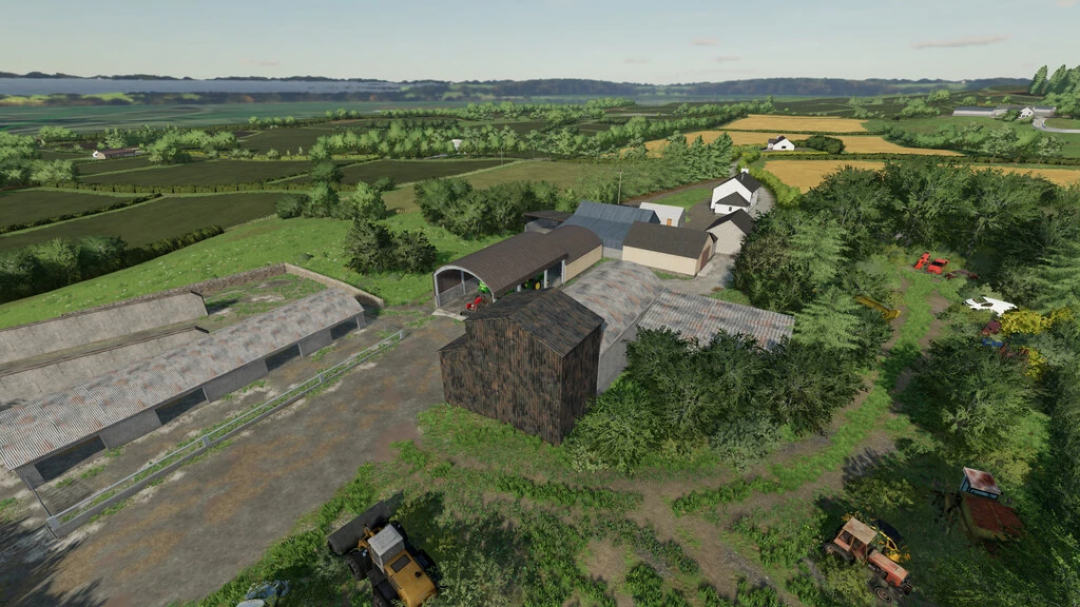 Aerial view of Ladyhill Map v1.1.0.0 in FS22, showcasing a detailed farm layout with fields, barns, and machinery.