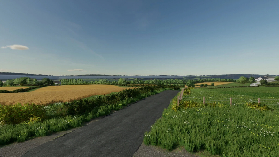 Vue pittoresque de la carte Ladyhill dans les mods FS22, avec des champs verdoyants et une route de campagne sous un ciel dégagé dans Farming Simulator 22.