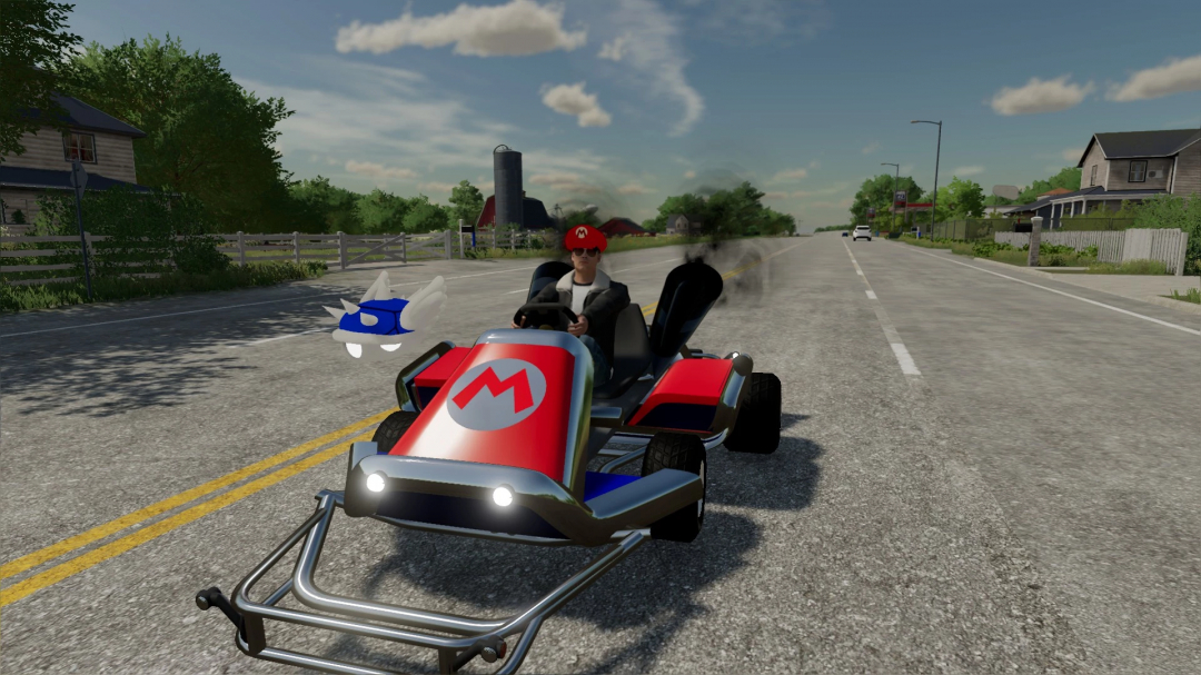 Mod FS22 Mario Kart v1.1.0.0 com um kart em uma estrada rural, adicionando elementos de corrida ao Farming Simulator 22.