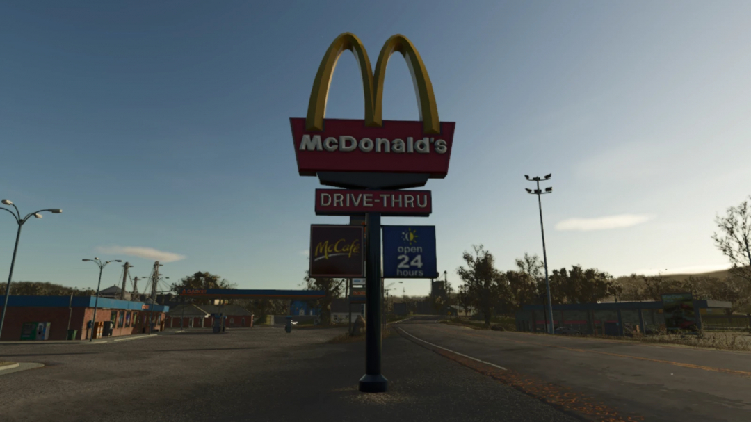 FS25 mod McDonald's Drive-Thru Sign v1.0.0.0, featuring a drive-thru sign and logos in a game setting.