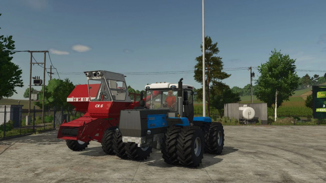 FS25 Moddir Wheels Fix v1.0.0.0: Tractor azul y cosechadora roja en una finca