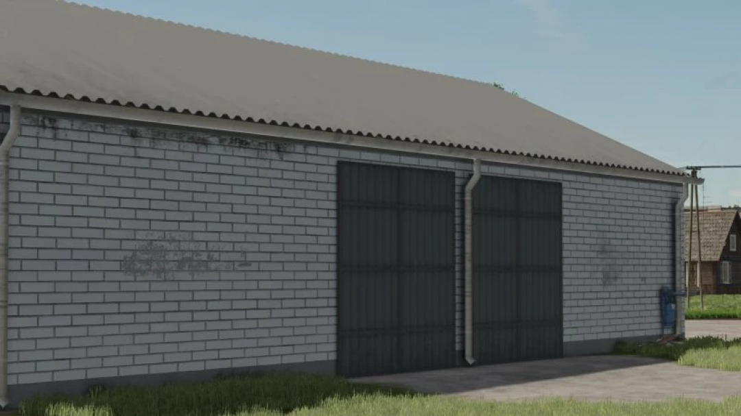 Modern Barn with Garage mod for FS25 featuring a brick exterior and large metal doors.