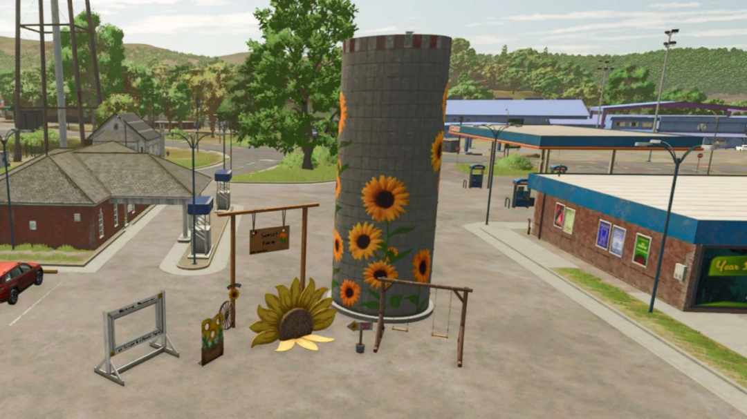 FS25 Riverbend Springs Props mod with sunflower-decorated silo in Farming Simulator 25.