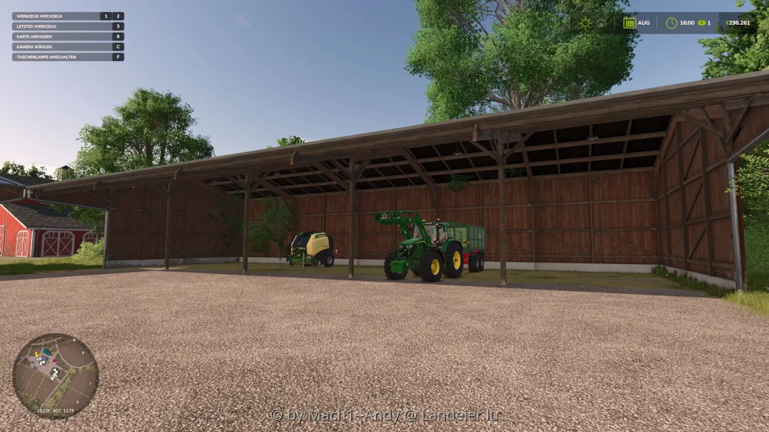 FS25 Shed Pack mod displaying a large wooden shed with farming equipment inside, set in a scenic rural area.