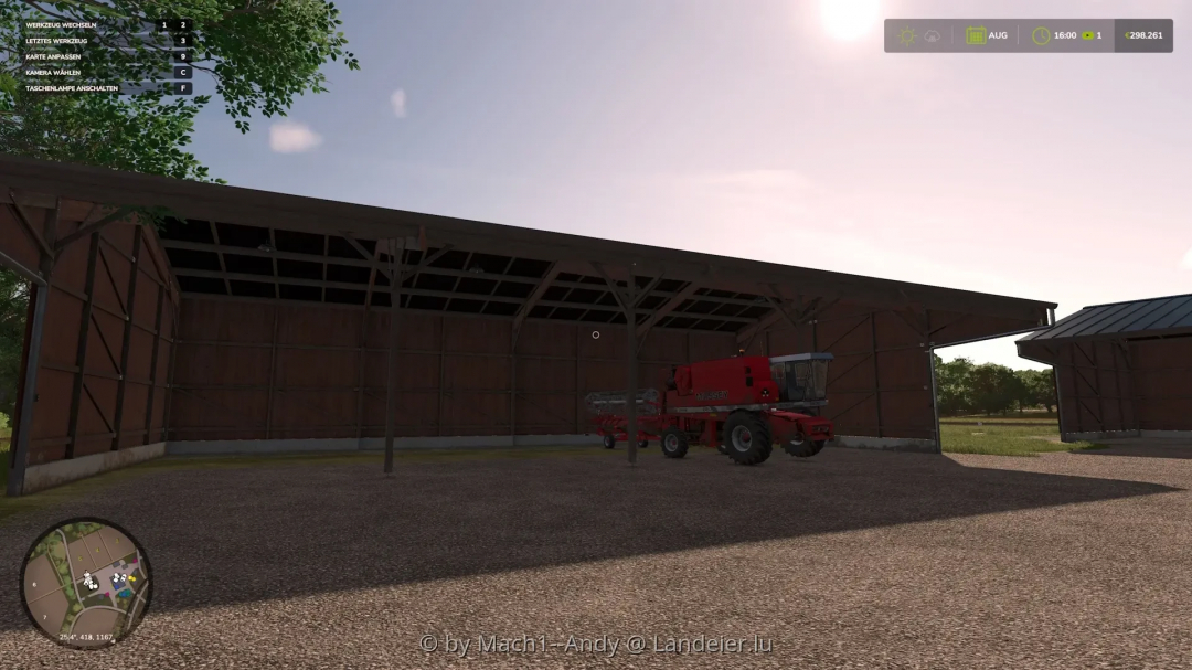 FS25 mods image showing a red harvester inside a large open shed with a visible control panel overlay.