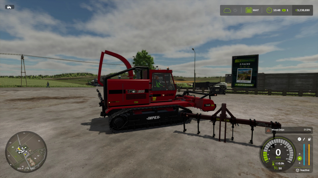 The Trex 600 mod in Farming Simulator 25, featuring a red tracked chipper in a rural setting.