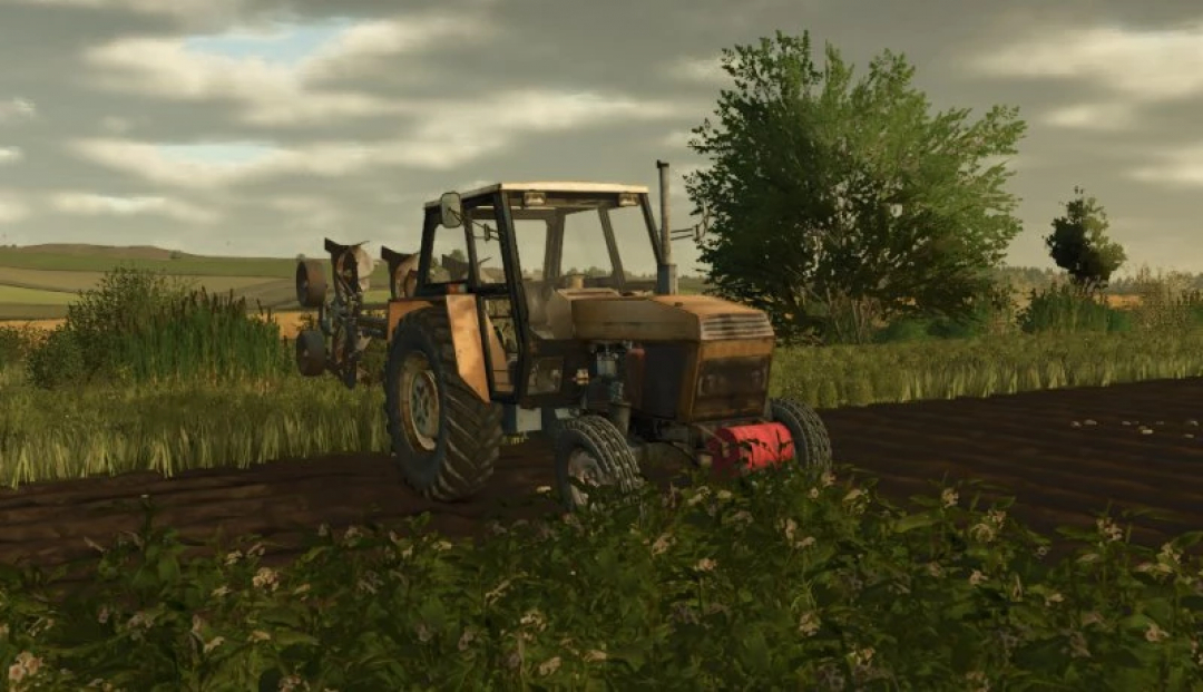 Ursus 920 tractor mod for FS25, plowing a field, showcasing realistic farming in Farming Simulator 25.