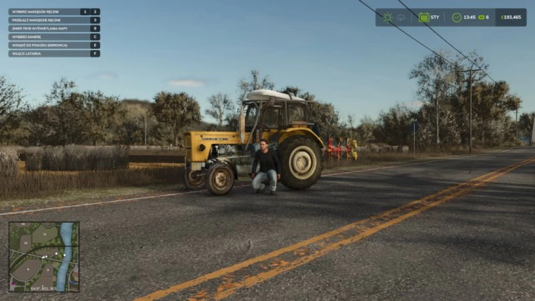 FS25 mod Ursus c-360 tractor on a rural road, used in Farming Simulator 25.