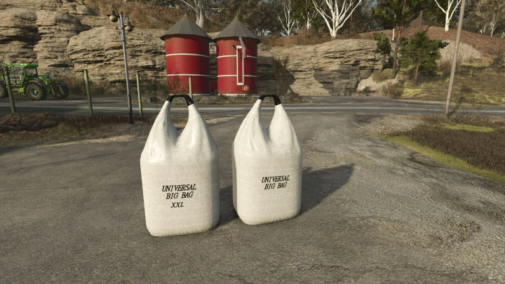 fs25-mods, FS25 mods featuring two large fillable big bags labeled 'Universal Big Bag XXL' on a farm road