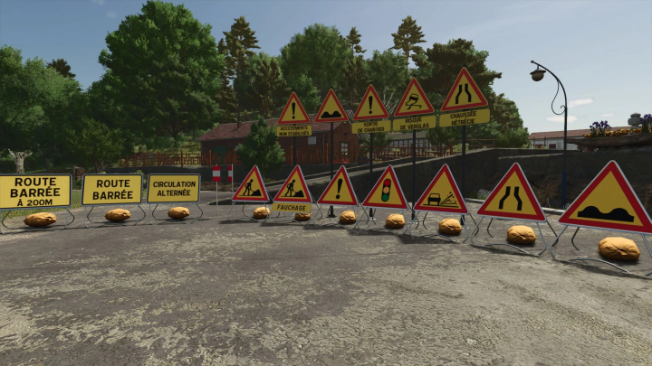 fs25-mods, FS25 mod image of various French temporary road signs, including 'Route Barrée' and warning indicators, set in a rural environment.