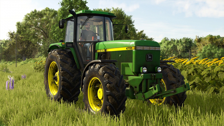 fs25-mods,  John Deere 4755 tractor mod in FS25 on field with flowers and trees.