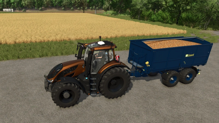 fs25-mods,  FS25 mod, Lizard Tardis v1.0.0.0, showcases a tractor towing a blue grain trailer in a field scenery.