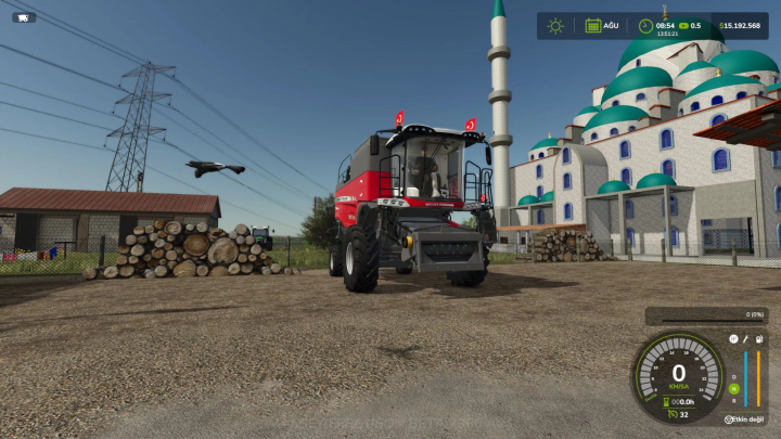 fs25-mods,  Massey Ferguson Beta 7360 combine mod in FS25 near logs and a mosque, showcasing Farming Simulator 25 mods.