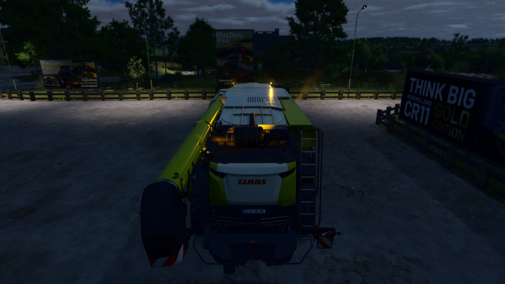 fs25-mods,  FS25 mod Random Beacon Light Speed at night, illuminating a CLAAS harvester parked outdoors.