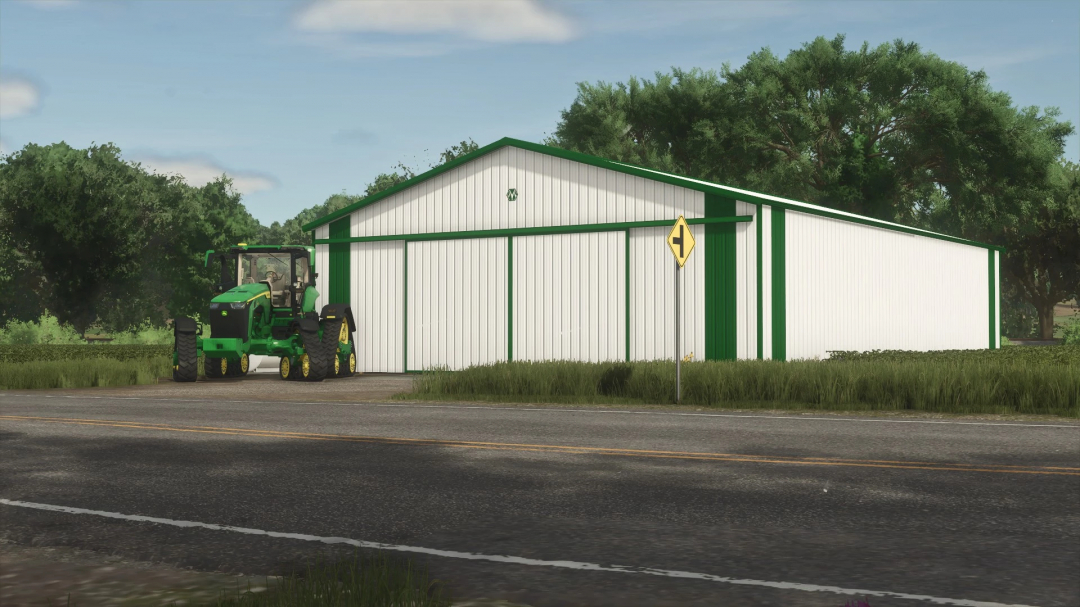 50x72 Morton Shed in FS25 with green tractor beside it, lush trees in background.