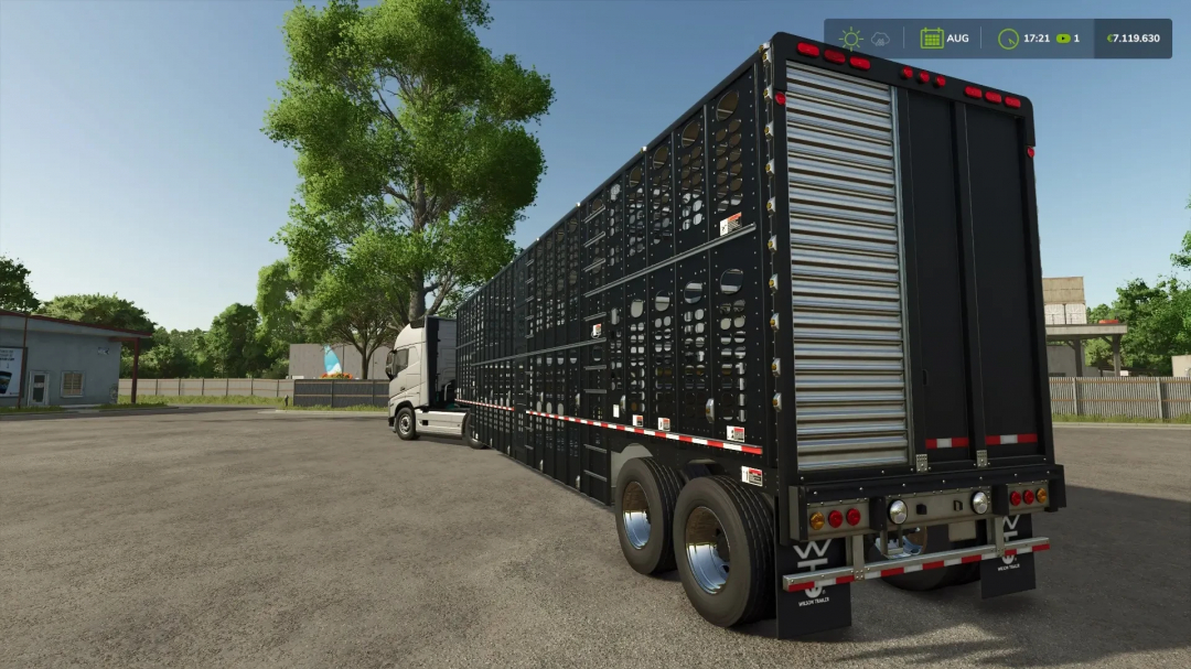 FS25 Animal Transport mod showing a large livestock trailer attached to a truck, parked on a farm with trees in the background.