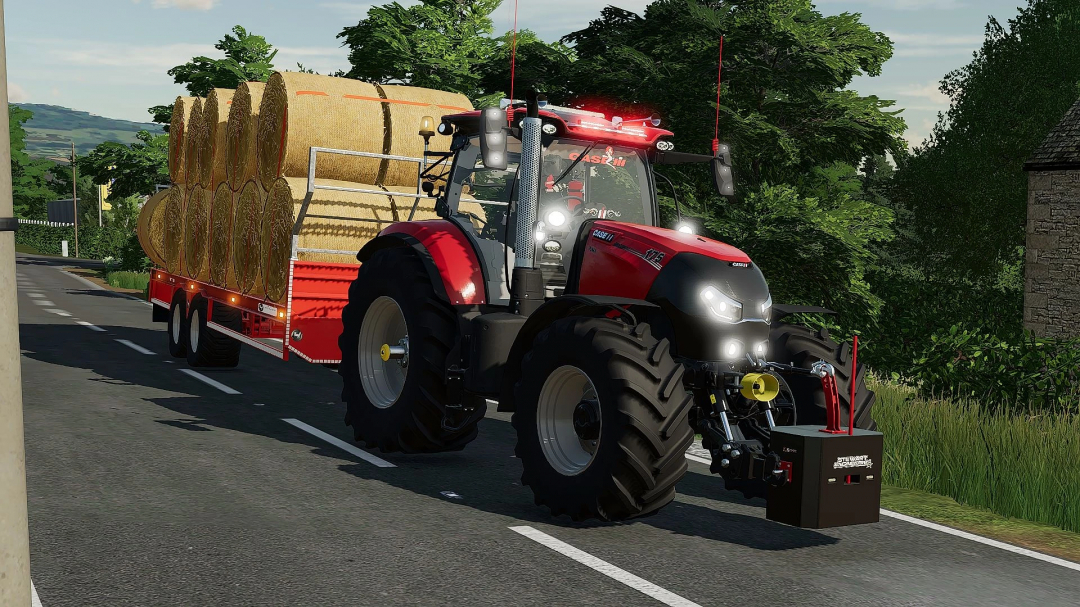 FS22 mod Case IH Puma 140-175cvx tractor hauling hay bales on road