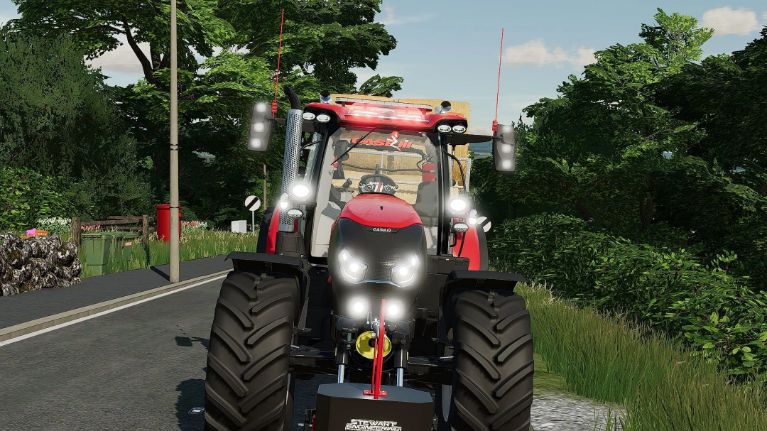 Front view of Case IH Puma 140-175cvx tractor mod in FS22, parked on a road amidst lush greenery.