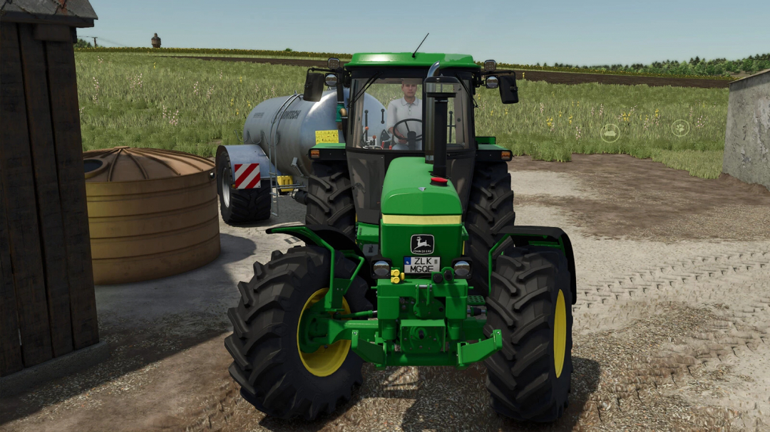 A green tractor parked on a farm in FS25 with Enhanced Filltype Categories mod.