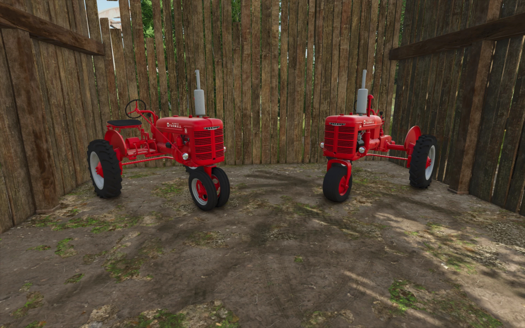 Two red Farmall B tractors in a wooden barn setting featured in FS25 mods.