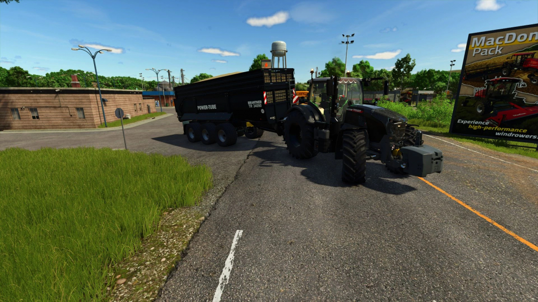 Fendt 700 Edit v1.0.0.0 mod in Farming Simulator 25 with Brantner trailer on a road surrounded by greenery and a billboard.