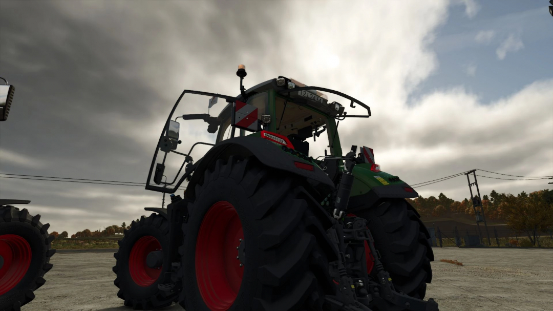 Fendt 700 Vario Edit v1.2.0.0 mod for FS25 showing a detailed close-up of the tractor's rear under a cloudy sky.