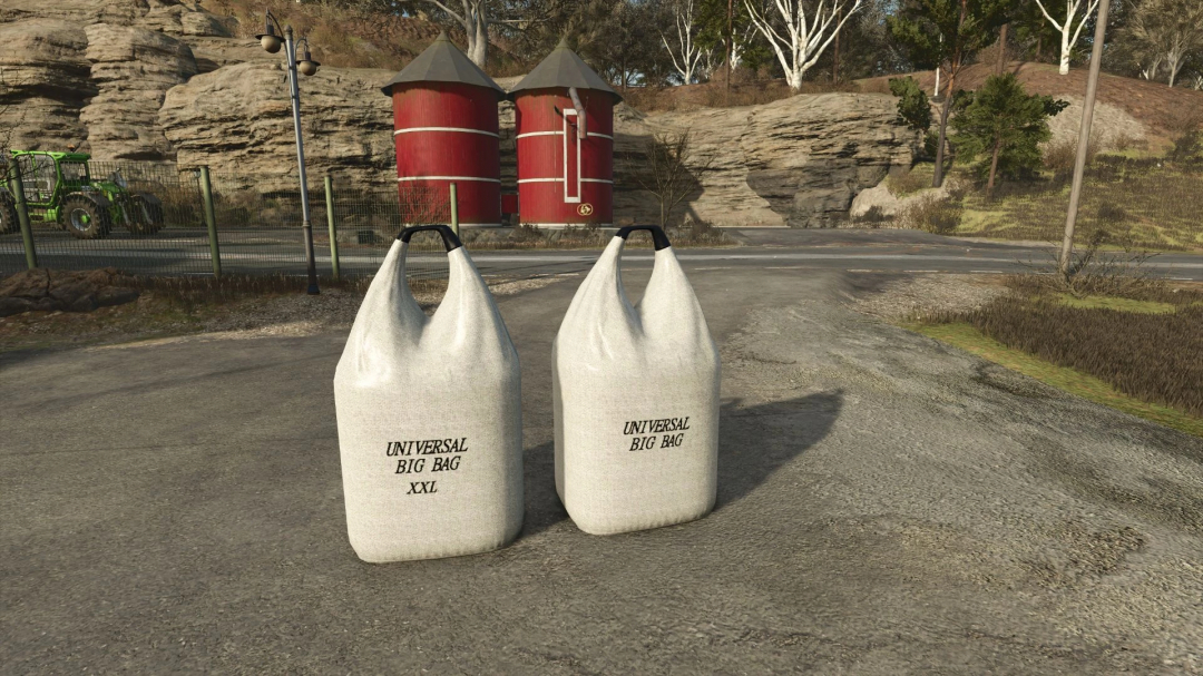 FS25 mods featuring two large fillable big bags labeled 'Universal Big Bag XXL' on a farm road