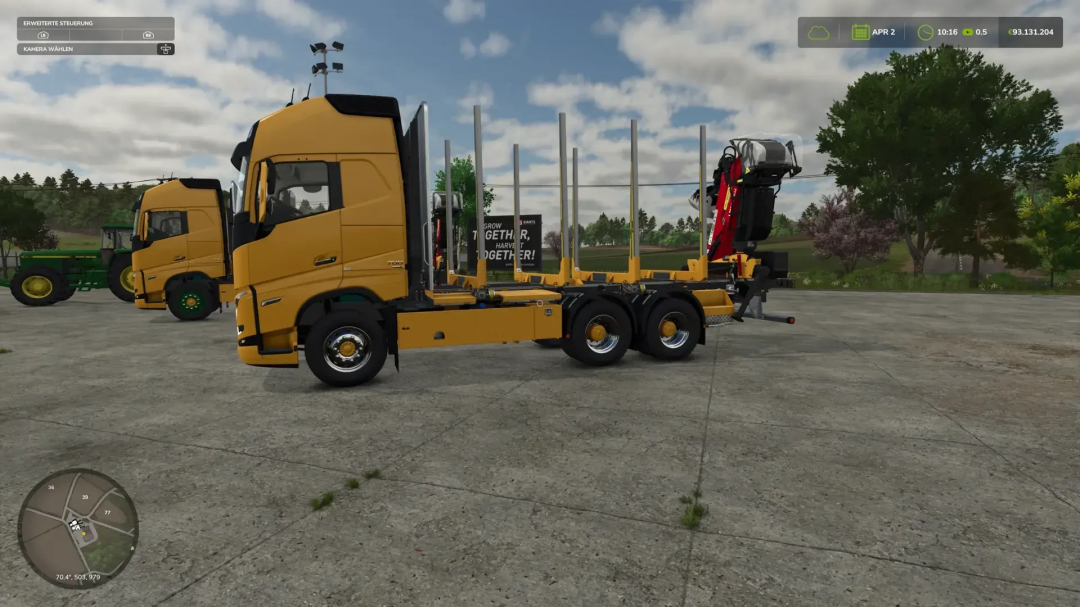 Forst LKW v1.0.0.0 mod in FS25, showing a yellow forestry truck parked on a farm.