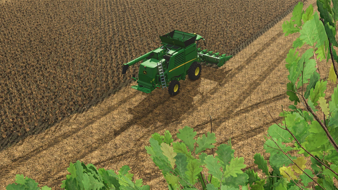 John Deere T560 harvesting in FS25 mod, showcasing farming simulation.