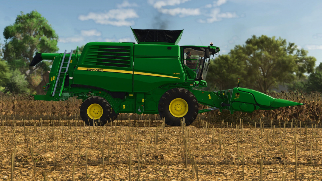 John Deere T560 harvester in a field, FS25 mods.