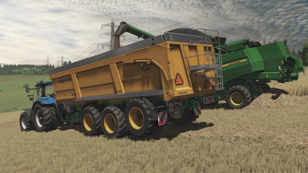 FS22 mod: Joskin Trans-SPACE 8000 Advantage v1.0.1.0 trailer with tractor in a field.