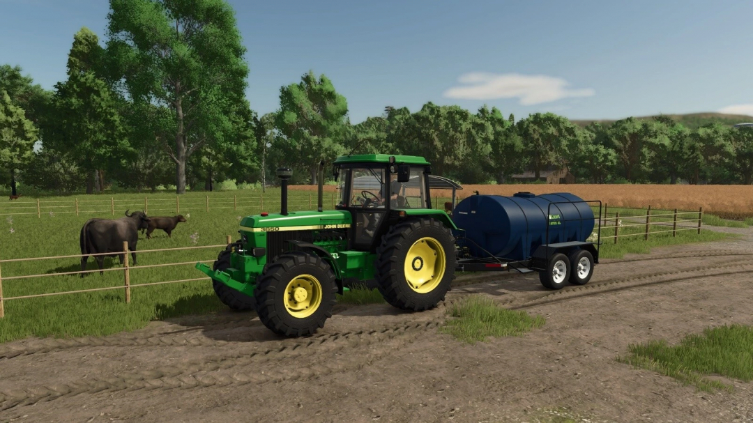 FS25 mod Lizard Tardis v1.0.0.0 showing a green tractor with a blue tank trailer in a farm setting with cows.