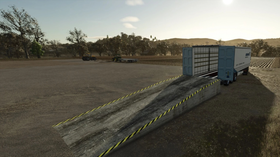 Image of a Placeable Ramp mod in Farming Simulator 25, featuring a concrete ramp leading to a trailer in a rural setting. FS25 mods enhance gameplay.