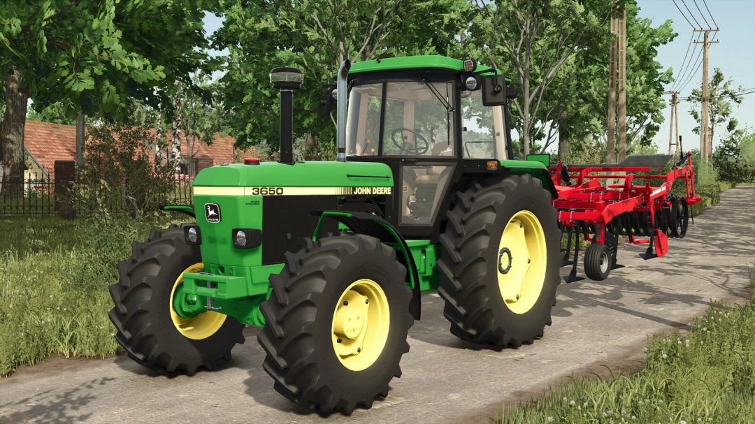 FS25 mod: John Deere 3650 tractor with red cultivator on a rural road in Farming Simulator 25.