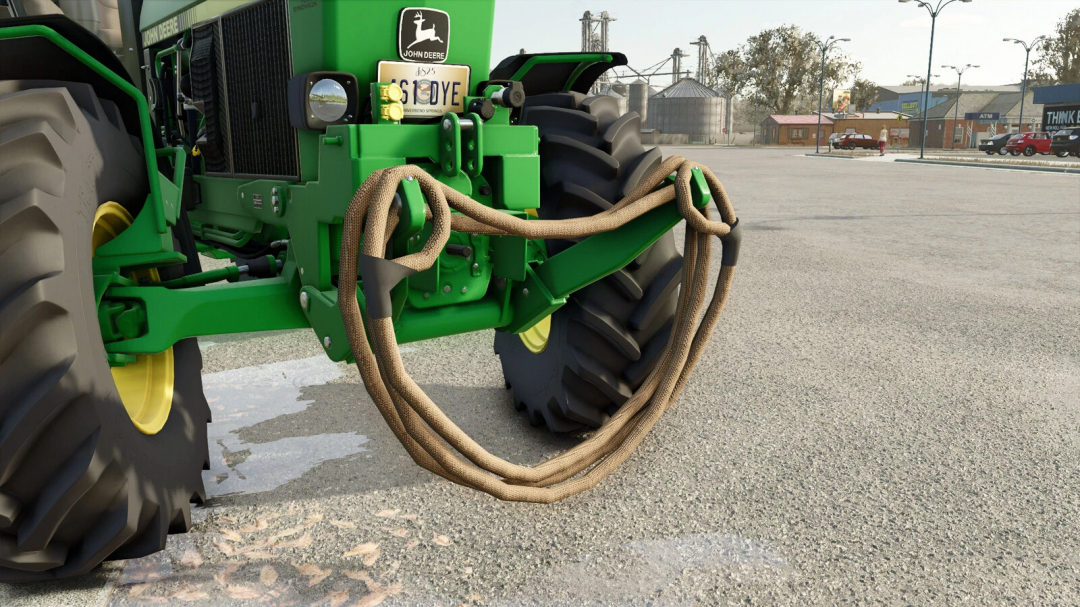 FS25 mod Rope And Chain v1.0.0.0 showing a green tractor front with attached rope in Farming Simulator 25.