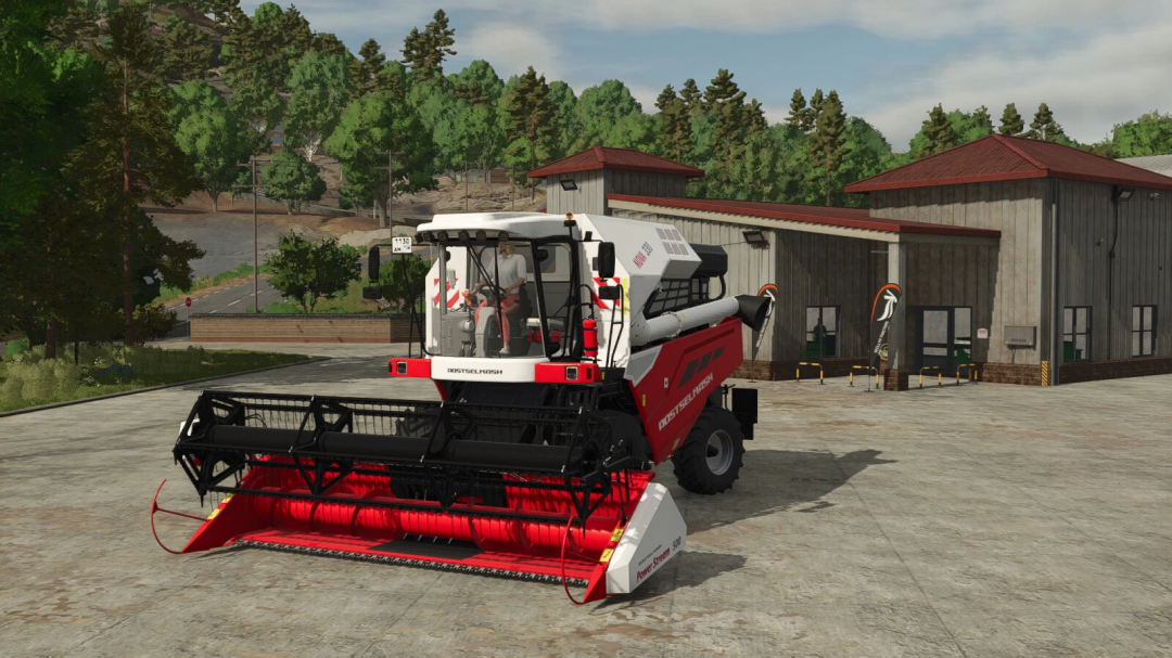 Rostselmash Nova 330 harvester mod in Farming Simulator 25, shown near a building with trees in the background.