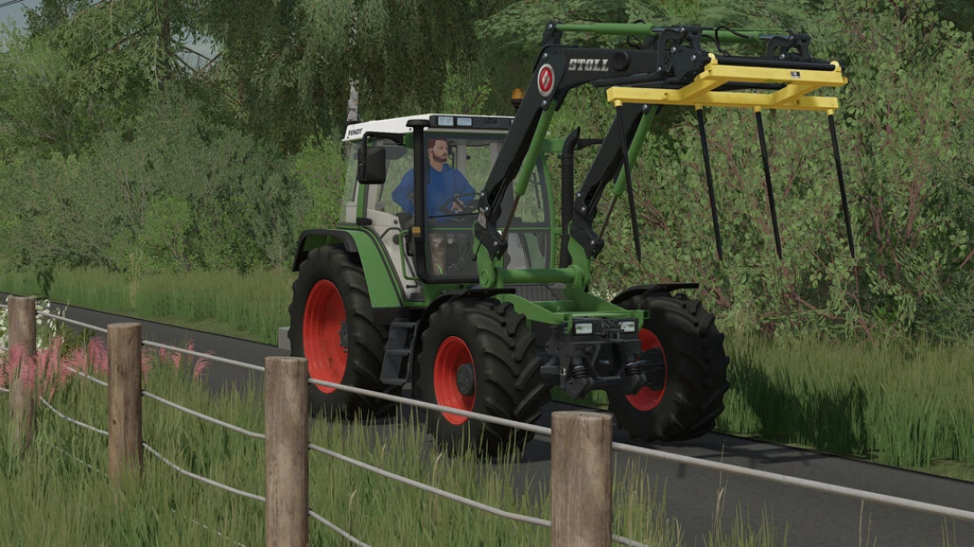 FS22 mod Stoll Frontloader GTA Xylon Pack v1.0.2.0: Green tractor with frontloader on rural road in Farming Simulator 22.