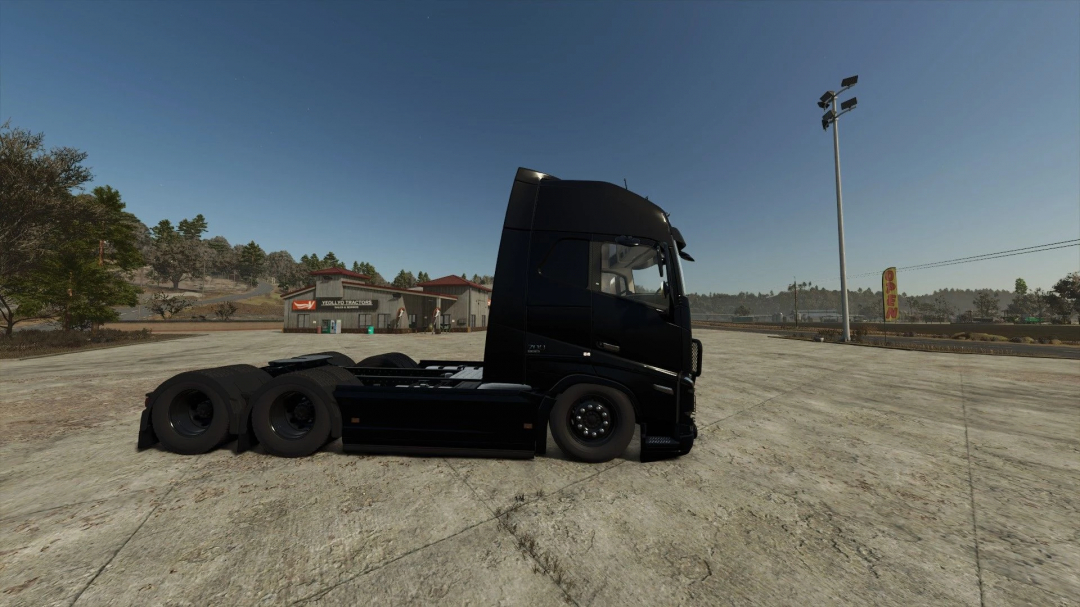 Side view of Volvo FH16 Edit mod in FS25, showcasing detailed truck design in a rural setting.