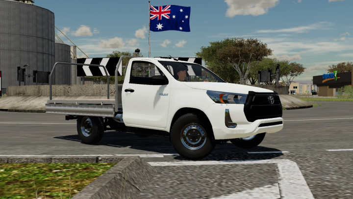 fs22-mods,  FS22 mod 2021 Toyota Hilux Ute in Farming Simulator 22, white pickup truck on road with Australian flag in background.