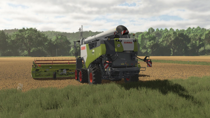 fs25-mods,  FS25 mod Claas Trion 700 v1.0.0.0 combine harvester in a wheat field.