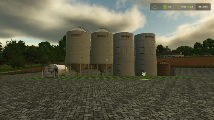 fs25-mods,  FS25 Storage Distribution mod features large silos with a cloudy sky in Farming Simulator 25.