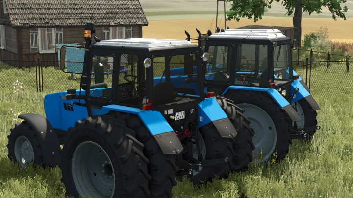 fs25-mods,  Two blue MTZ 1221 tractors in a grassy yard in FS25 mod, showcasing Farming Simulator 25 environment.