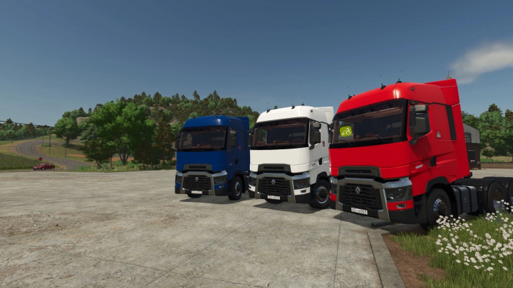 fs25-mods,  Three Renault Trucks T in blue, white, and red parked in Farming Simulator 25 mod.